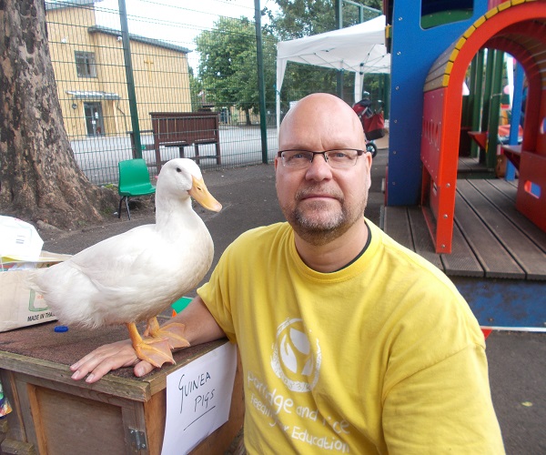 guinea pigs, hedgehogs, mini-lop rabbits, and Pekin Bantam chickens meet children who want to pet them